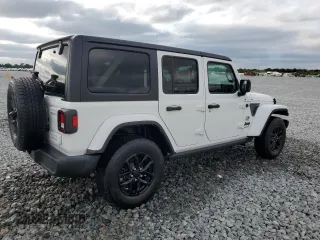 2023 Jeep Wrangler Sport S with VIN 1C4HJXDNXPW569699, listed as a Copart auction lot 52392145 with 32,972 mi miles and Salvage title. Bid and sale history available at DreamBid. Image 3.