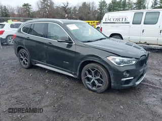 2018 BMW X1 xDrive28i with VIN WBXHT3C34J5K31430, listed as a IAAI auction lot 41954792 with 125,447 mi miles. Bid and sale history available at carsss.com. Image 1.