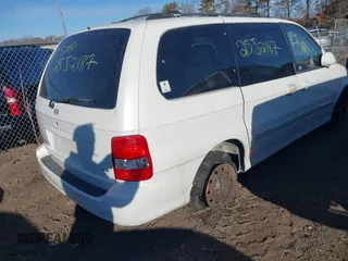 2005 Kia Sedona LX with VIN KNDUP132756764528, listed as a IAAI auction lot 41709414 with 999,999 mi miles. Bid and sale history available at carsss.com. Image 4.
