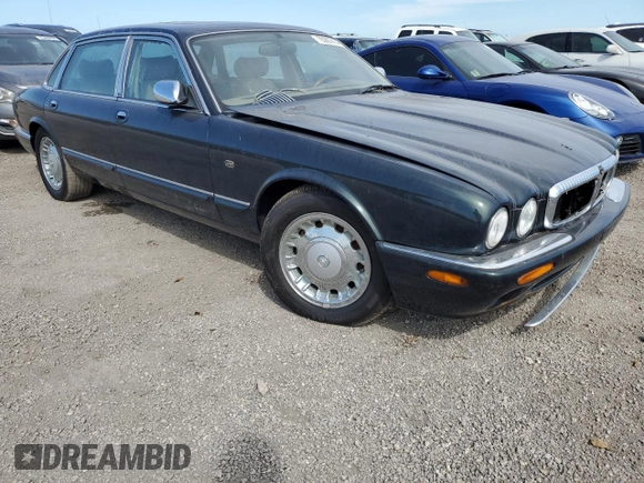 1999 Jaguar XJ with VIN SAJKX6047XC861227, listed as a Copart auction lot 75007414 with Not provided miles and Salvage title. Bid and sale history available at DreamBid. Image 4.
