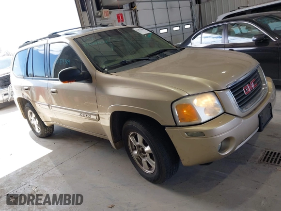 2004 GMC Envoy SLE with VIN 1GKDT13S442136464, listed as a IAAI auction lot 41874304 with 250,330 mi miles. Bid and sale history available at carsss.com. Image 1.