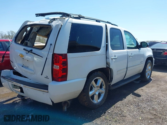 2013 Chevrolet Tahoe LTZ with VIN 1GNSKCE08DR161606, listed as a IAAI auction lot 41984912 with 189,181 mi miles and . Bid and sale history available at DreamBid. Image 4.