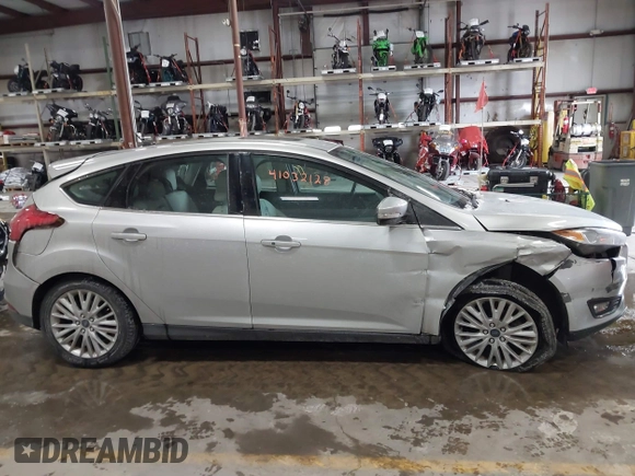 2018 Ford Focus Titanium with VIN 1FADP3N25JL261736, listed as a IAAI auction lot 41032128 with 59,142 mi miles and . Bid and sale history available at DreamBid. Image 13.