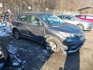 2015 Honda CR-V LX with VIN 3CZRM3H37FG712323, listed as a IAAI auction lot 41199071 with 183,165 mi miles. Bid and sale history available at carsss.com. Image 1.