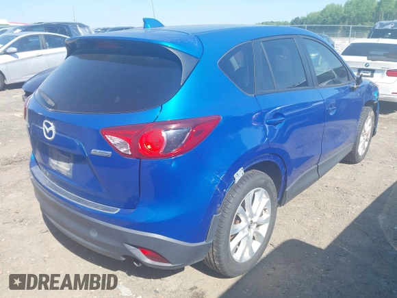 2013 Mazda CX-5 Grand Touring with VIN JM3KE2DEXD0123314, listed as a IAAI auction lot 42064266 with 288,935 mi miles. Bid and sale history available at carsss.com. Image 4.