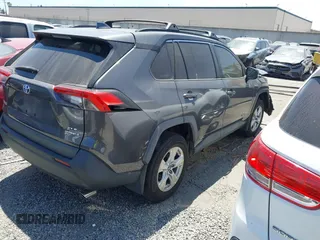 2020 Toyota RAV4 Hybrid XLE with VIN 2T3RWRFV5LW058103, listed as a IAAI auction lot 42665299 with 112,634 mi miles and . Bid and sale history available at DreamBid. Image 4.