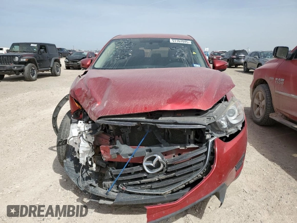 2016 Mazda CX-5 Sport with VIN JM3KE2BY8G0874641, listed as a Copart auction lot 51167845 with 104,571 mi miles and Clean Title. Bid and sale history available at carsss.com. Image 5.