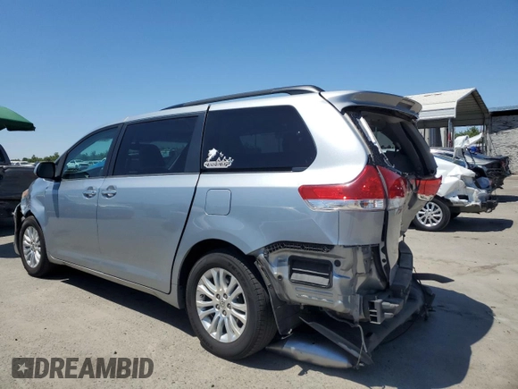 2014 Toyota Sienna XLE with VIN 5TDYK3DCXES496657, listed as a Copart auction lot 60498015 with 178,486 mi miles and Salvage title. Bid and sale history available at DreamBid. Image 2.