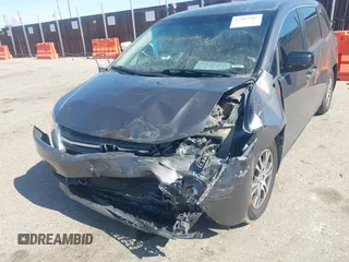 2012 Honda Odyssey EX-L with VIN 5FNRL5H61CB095789, listed as a IAAI auction lot 42065507 with 138,570 mi miles and . Bid and sale history available at DreamBid. Image 6.