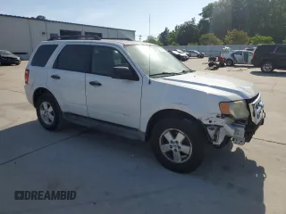 2009 Ford Escape XLS with VIN 1FMCU02719KB53740, listed as a Copart auction lot 55210035 with 144,672 mi miles and Salvage title. Bid and sale history available at DreamBid. Image 4.