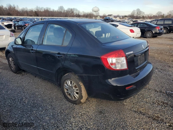 2012 Suzuki SX4 LE with VIN JS2YC5A32C6302316, listed as a Copart auction lot 81703544 with 87,411 mi miles and Salvage Title. Bid and sale history available at carsss.com. Image 2.