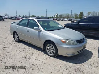 2002 Toyota Camry LE z VIN 4T1BE32K42U606483, wystawiony jako IAAI lot #42036341 z przebiegiem 204 566 mil mil oraz . Historia ofert i sprzedaży dostępna na DreamBid. Obrazek 1.
