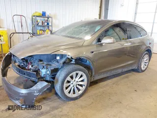 2016 Tesla Model X 70D with VIN 5YJXCBE27GF004974, listed as a IAAI auction lot 41630556 with 167,709 mi miles. Bid and sale history available at carsss.com. Image 2.