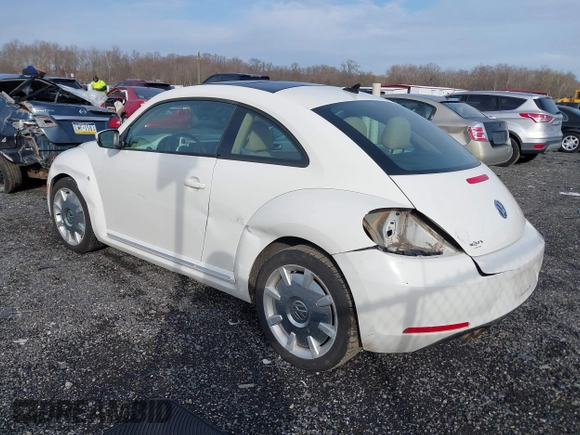 2014 Volkswagen Beetle 2.5L w/Sun with VIN 3VWJP7AT8EM611560, listed as a IAAI auction lot 41488488 with 140,798 mi miles and . Bid and sale history available at DreamBid. Image 3.