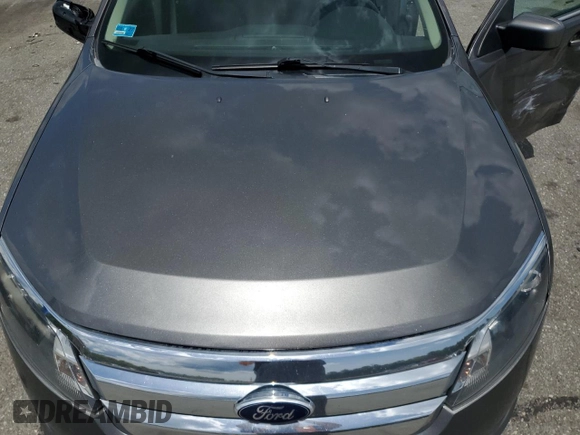 2012 Ford Fusion SE z VIN 3FAHP0HA6CR183815, wystawiony jako Copart lot #58187975 z przebiegiem 118 101 mil mil oraz Szkoda całkowita • Salvage title. Historia ofert i sprzedaży dostępna na DreamBid. Obrazek 11.