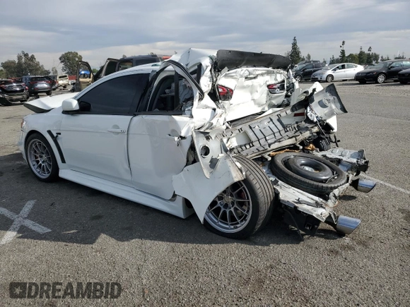 2014 Mitsubishi Lancer Evolution GSR z VIN JA32W8FV2EU019253, wystawiony jako Copart lot #86615084 z przebiegiem 104 894 mil mil oraz Szkody całkowita. Historia ofert i sprzedaży dostępna na DreamBid. Obrazek 2.