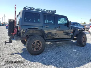 2014 Jeep Wrangler Unlimited Sport with VIN 1C4BJWDGXEL269693, listed as a Copart auction lot 46927895 with 105,691 mi miles and Salvage Title. Bid and sale history available at carsss.com. Image 3.