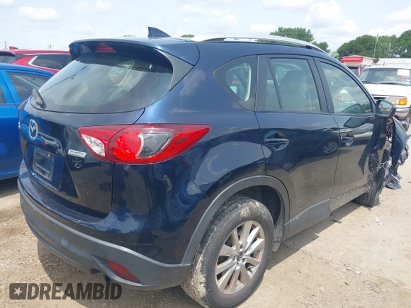 2016 Mazda CX-5 Sport z VIN JM3KE2BY0G0633611, wystawiony jako IAAI lot #42390654 z przebiegiem Nie podano mil oraz . Historia ofert i sprzedaży dostępna na DreamBid. Obrazek 4.