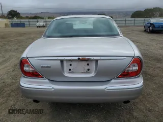 2004 Jaguar XJ with VIN SAJEA74C34SG09548, listed as a Copart auction lot 71754774 with 142,804 mi miles and Salvage Title. Bid and sale history available at DreamBid. Image 6.