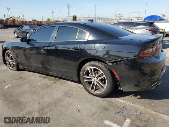 2019 Dodge Charger SXT with VIN 2C3CDXJG8KH757818, listed as a Copart auction lot 49518475 with 98,129 mi miles and Salvage Title. Bid and sale history available at DreamBid. Image 2.