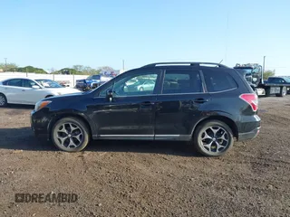 2015 Subaru Forester 2.0XT Touring with VIN JF2SJGUC0FH516972, listed as a IAAI auction lot 41483033 with 103,970 mi miles. Bid and sale history available at carsss.com. Image 14.