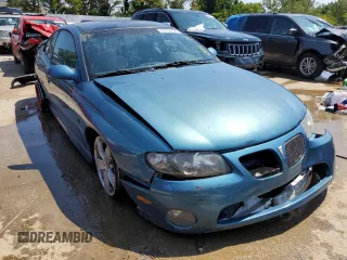 2004 Pontiac GTO z VIN 6G2VX12G24L282560, wystawiony jako Copart lot #67750724 z przebiegiem 153 582 mil mil oraz Szkody całkowita. Historia ofert i sprzedaży dostępna na DreamBid. Obrazek 4.