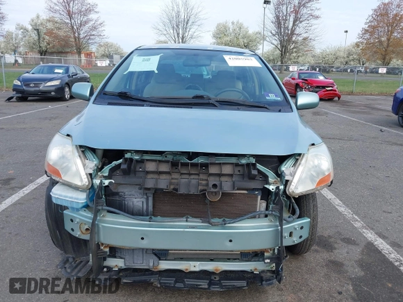 2009 Toyota Yaris with VIN JTDBT903794060474, listed as a IAAI auction lot 42005903 with 104,607 mi miles. Bid and sale history available at carsss.com. Image 12.