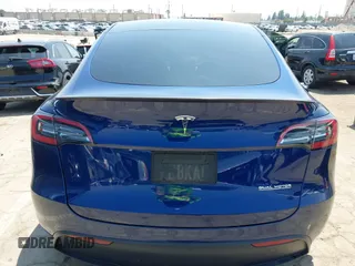 2022 Tesla Model Y Performance z VIN 7SAYGDEF7NF393235, wystawiony jako IAAI lot #42106027 z przebiegiem 50 959 mil mil oraz . Historia ofert i sprzedaży dostępna na DreamBid. Obrazek 16.