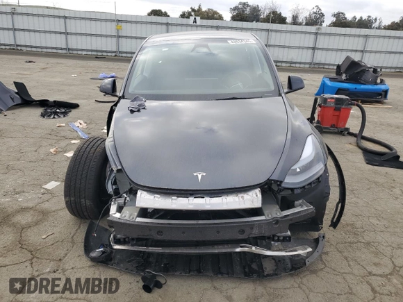 2025 Tesla Model Y Long Range with VIN 7SAYGDED6SF227475, listed as a Copart auction lot 42634345 with 3,493 mi miles and Salvage Title. Bid and sale history available at DreamBid. Image 5.