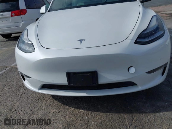 2021 Tesla Model Y Long Range with VIN 5YJYGDEE0MF069451, listed as a IAAI auction lot 41482649 with 55,542 mi miles. Bid and sale history available at carsss.com. Image 6.