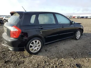 2005 Kia Spectra with VIN KNAFE161655093051, listed as a Copart auction lot 77821904 with 104,874 mi miles and Salvage Title. Bid and sale history available at carsss.com. Image 3.