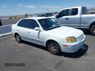 2003 Hyundai Accent GL z VIN KMHCG45C93U457529, wystawiony jako IAAI lot #42485305 z przebiegiem 218 757 mil mil oraz . Historia ofert i sprzedaży dostępna na DreamBid. Obrazek 1.