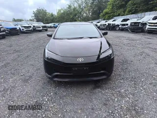2024 Toyota Prius LE z VIN JTDADABU4R3013862, wystawiony jako Copart lot #74573904 z przebiegiem 6 mil mil oraz Czysty tytuł • Clean title. Historia ofert i sprzedaży dostępna na DreamBid. Obrazek 5.
