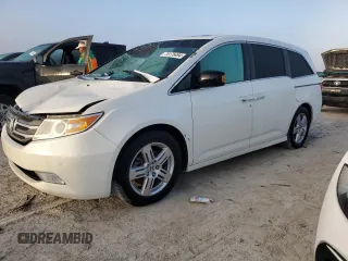 2012 Honda Odyssey Touring with VIN 5FNRL5H96CB144690, listed as a Copart auction lot 75176494 with 0 mi miles and Salvage Title. Bid and sale history available at carsss.com. Image 1.