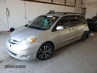 2010 Toyota Sienna XLE with VIN 5TDYK4CCXAS323450, listed as a Copart auction lot 62491545 with 220,121 mi miles and Salvage title. Bid and sale history available at DreamBid. Image 1.