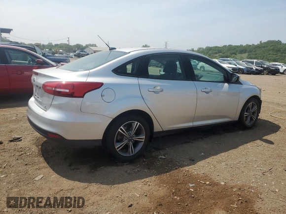 2017 Ford Focus SE with VIN 1FADP3FE7HL290271, listed as a Copart auction lot 60665615 with 130,409 mi miles and Salvage title. Bid and sale history available at DreamBid. Image 3.