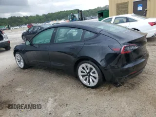 2022 Tesla Model 3 with VIN 5YJ3E1EA0NF372095, listed as a Copart auction lot 54958215 with 148,441 mi miles and Clean Title. Bid and sale history available at DreamBid. Image 2.