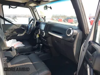 2012 Jeep Wrangler Unlimited Sahara with VIN 1C4HJWEG9CL146750, listed as a IAAI auction lot 41512678 with 94,952 mi miles. Bid and sale history available at carsss.com. Image 5.