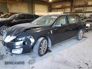 2012 Lincoln MKS with VIN 1LNHL9DR1CG806704, listed as a Copart auction lot 87666765 with 111,933 mi miles and Salvage Title. Bid and sale history available at carsss.com. Image 1.