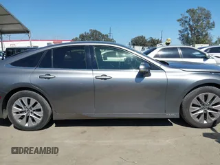 2021 Toyota Mirai XLE with VIN JTDAAAAAXMA002000, listed as a IAAI auction lot 42207752 with 33,017 mi miles and . Bid and sale history available at DreamBid. Image 14.