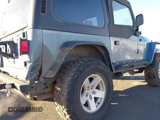 1998 Jeep Wrangler Sport with VIN 1J4FY19S4WP716469, listed as a IAAI auction lot 41506513 with 142,289 mi miles. Bid and sale history available at carsss.com. Image 6.