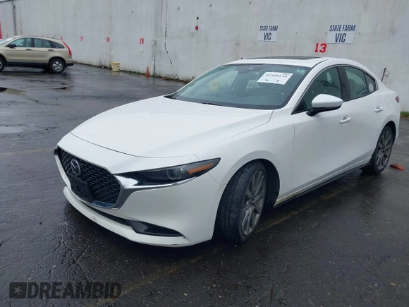 2020 Mazda 3 Premium with VIN 3MZBPBEMXLM133357, listed as a IAAI auction lot 41540234 with 81,280 mi miles and . Bid and sale history available at DreamBid. Image 2.