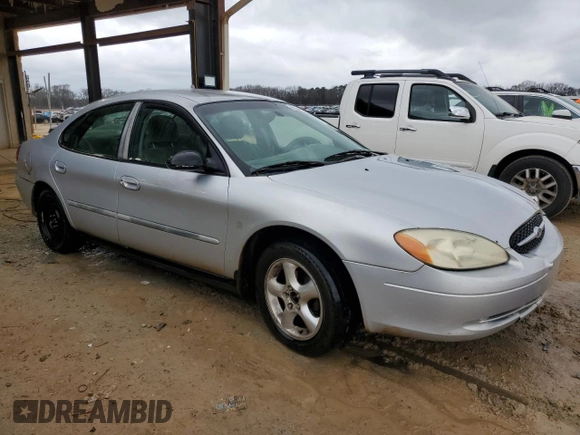 2000 Ford Taurus SE with VIN 1FAFP532XYA141783, listed as a Copart auction lot 43949795 with 203,939 mi miles and Salvage Title. Bid and sale history available at DreamBid. Image 4.