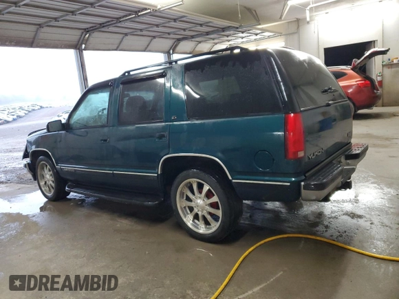 1998 GMC Yukon with VIN 1GKEC13RXWJ731667, listed as a Copart auction lot 78848954 with 202,164 mi miles and Salvage Title. Bid and sale history available at carsss.com. Image 2.