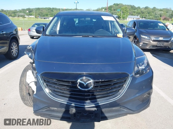 2015 Mazda CX-9 Sport z VIN JM3TB2BAXF0465720, wystawiony jako IAAI lot #42305436 z przebiegiem 130 543 mil mil oraz . Historia ofert i sprzedaży dostępna na DreamBid. Obrazek 12.