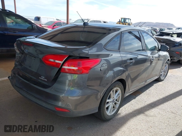 2015 Ford Focus SE with VIN 1FADP3F27FL374531, listed as a IAAI auction lot 42123579 with 128,884 mi miles and . Bid and sale history available at DreamBid. Image 4.