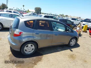 2013 Honda Fit z VIN JHMGE8H34DC082914, wystawiony jako IAAI lot #42288271 z przebiegiem 186 269 mil mil oraz . Historia ofert i sprzedaży dostępna na DreamBid. Obrazek 13.