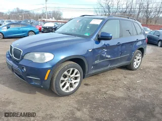 2011 BMW X5 35i with VIN 5UXZV4C56BL412415, listed as a IAAI auction lot 41611847 with 141,848 mi miles. Bid and sale history available at carsss.com. Image 2.
