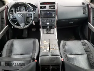 2015 Mazda CX-9 Grand Touring z VIN JM3TB2DA3F0452322, wystawiony jako Copart lot #57821285 z przebiegiem 147 610 mil mil oraz Czysty tytuł • Clean title. Historia ofert i sprzedaży dostępna na DreamBid. Obrazek 8.