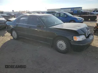 1997 Acura RL Premium Pkg with VIN JH4KA9656VC008041, listed as a Copart auction lot 82236834 with 0 mi miles and Salvage Title. Bid and sale history available at carsss.com. Image 4.